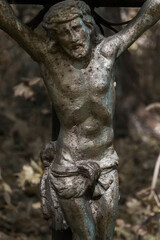 Fototapeta na wymiar Ancient metal sculpture of the crucifixion of Jesus Christ