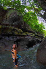 Girl hiking in Hidden Canyon Beji Guwang Bali Indonesia
