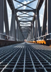 Foto op Plexiglas Tracks on the steel railway bridge © nicolagiordano