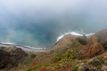 Misty Madeira Skywalk down the cliff onto the ocean