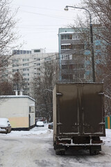 the truck is parked in a snow-covered yard