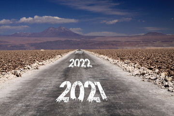 Long hard stony way, climate change target concept: view on endless dirt road through dry desert...