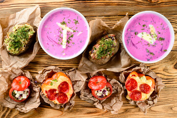 Vegetable rustic food, stuffed potatoes, beetroot soup and stuffed tomatoes with meat