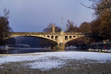 Winter wonderland landscape nature scenery at river bank of Isar with waterfall cascades and...