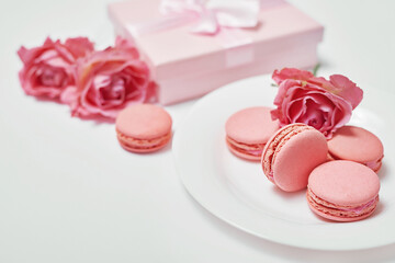 Macaroon sweets. Valentine's day greeting card. Flowers and gifts boxes on white background. Happy birthday and mother's day template.