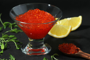 A small glass vase with red caviar