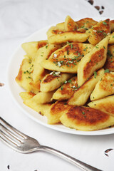 Polish dish kopytka served at the table