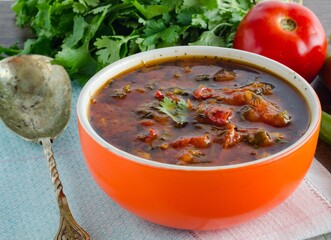 Bowl of traditional soup Borscht on table