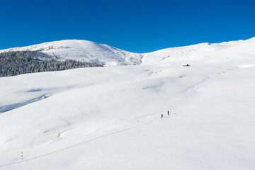 Fototapeta na wymiar Aerial drone photograph with skier touring in Bucegi mountains, Carpathian range, Romania