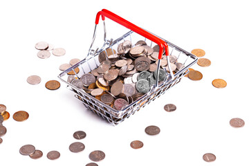 Metal basket with metal money coins on white background - multicurrency basket concept