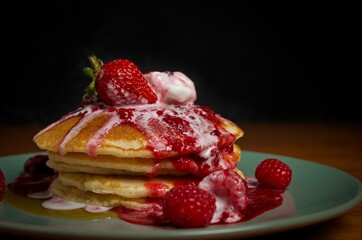 pancakes with berries on a plate