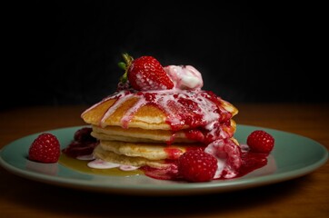 pancakes with berries on a plate