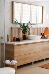 Modern bathroom interior with stylish mirror and vessel sink