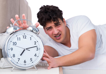 Man in bed suffering from insomnia