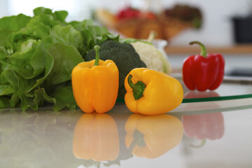 Kitchen interiors. Many vegetables and other meal at glass table are ready for been cooked soon