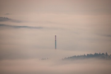 Factory chimney in the fog