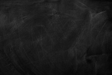 Fototapeta premium Texture of chalk on black chalkboard or blank blackboard background. School education, dark wall backdrop, template for learning board concept.