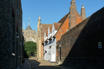 Rye, England - A view down an alleyway of St Mary’s Parish Church, which is 900 years old and a major landmark in Rye's town centre.  Image has copy space.