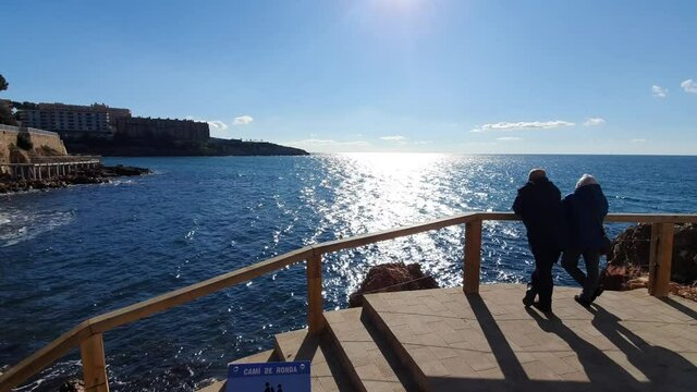 People standing by the sea in Salou