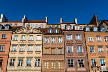 Fototapeta na wymiar Facades of colorful old Medieval houses in Stare Miasto (Warsaw Old Town), Warsaw, Poland - Europe