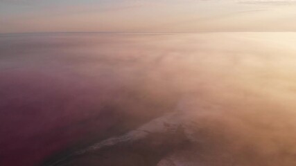 Aerial drone view to misty Salt mineral lake with pink water and coastline. Fantasy, remote, surreal, unearthly landscape Kherson region, Ukraine