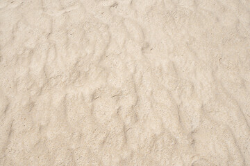 Natural Texture of Sand beach with wave curve of sand on beach in sunny day Image for nature travel background Summer Design concept