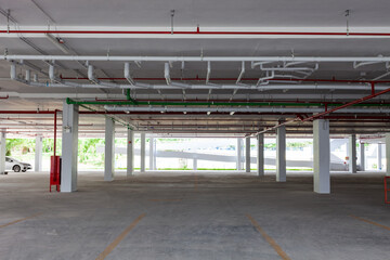Empty new parking garage underground interior in apartment or business building office and supermarket store