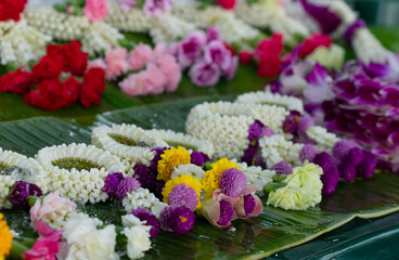 beuatiful thai traditional style flower garland made of many type of flowers for sale in fresh market