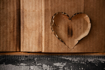 Grunge Burnt Heart on Corrugated Paper Texture Background