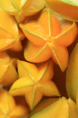 Vertical Image of Pile of Fresh Ripe Star Fruits or Carambola for Background or Wallpaper