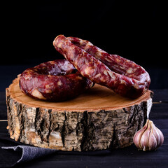 Homemade sausages in a traditional smoker smoked sausage. Traditional food. Smoked sausages meat In Smokehouse. homemade rustic sausage