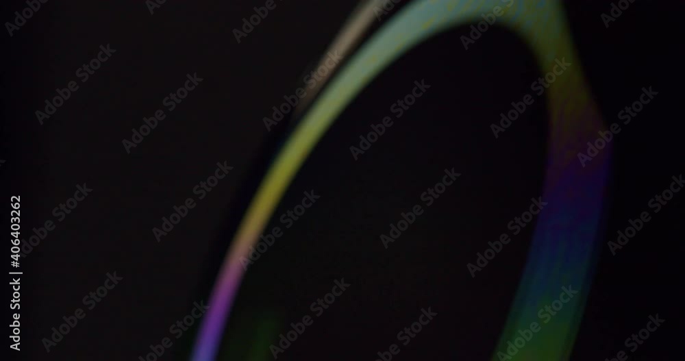 Poster macro shot of a light animation getting projected onto a soap bubble. abstract experimental macro sh