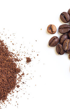 A pile of whole roasted coffee beans and another pile of grounded coffee on an isolated white background, from a high angle view covering the corners of the frame. © Gabriel