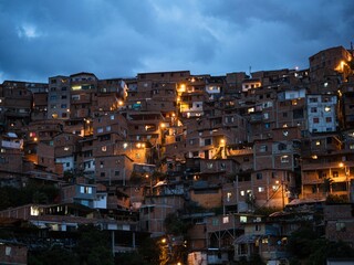 Panorama night cityscape of Juan XXIII neighborhood in San Javier Comuna 13 Medellin Colombia South...