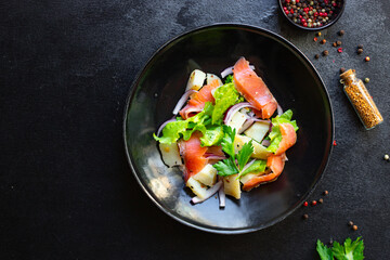 salmon salad vegetables lettuce, potato, seafood ready to eat on the table for healthy meal snack outdoor top view copy space for text food background image rustic keto or paleo diet pescetarian