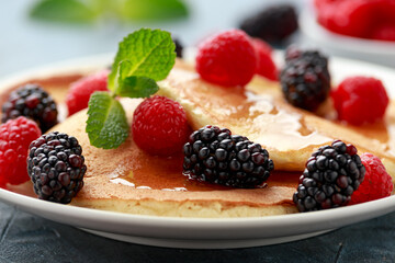 Morning breakfast Pancakes with fresh berry and honey. Healthy food