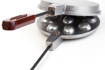 Special frying pan for making cookies nuts with condensed milk isolated on white background