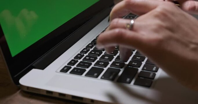 Woman Hands Typing on Laptop. Green Screen Background