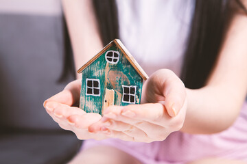 girl holding a model at home