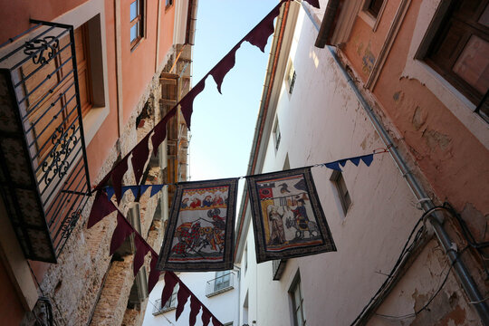 Fototapeta christmas and new year decoration on the narrow beautiful street of spanish town Xativa