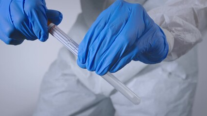 Nurse testing for Coronavirus with nasal swab test in a laboratory. Covid-19 virus pandemic. - Powered by Adobe