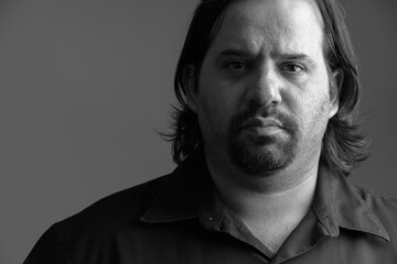 Close up of fat Caucasian man in the dark