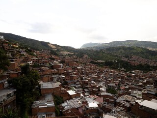 Panorama cityscape of colorful brick houses in Comuna 13 San Javier neighborhood poverty slum in...