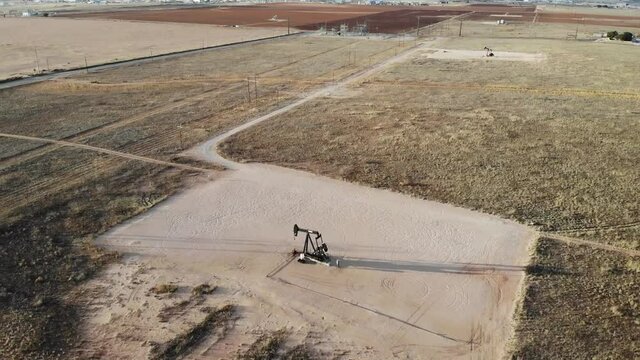 Located just outside the city of Midland, Texas there are just fields of Pumpjacks. Here is one! This shot features the vast desert around the pumpjack.