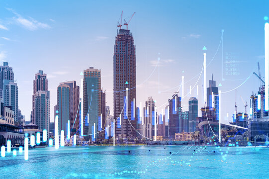 Skyscrapers of Dubai business downtown. International hub of trading and financial services of Western Asia. FOREX graph and chart concept. Double exposure. Dubai Canal waterfront.