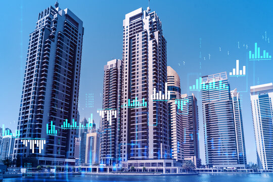 Skyscrapers of Dubai business downtown. International hub of trading and financial services of Western Asia. FOREX graph and chart concept. Double exposure. Dubai Canal waterfront.