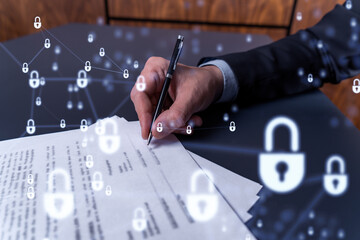 A businessman in formal wear signing the contract to prevent probability of risks in cyber...