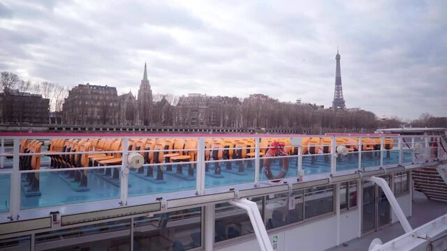 Empty tourist river boats in Paris during lockdown during the Covid-19 pandemic, with view of the Eiffel Tower, tourism in France