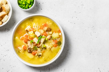 Yellow split pea soup puree with bacon. Space for text, top view.