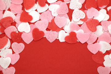 Red pink and white hearts on a red background. Valentine's day concept. Selective focus. Postcard. Background.